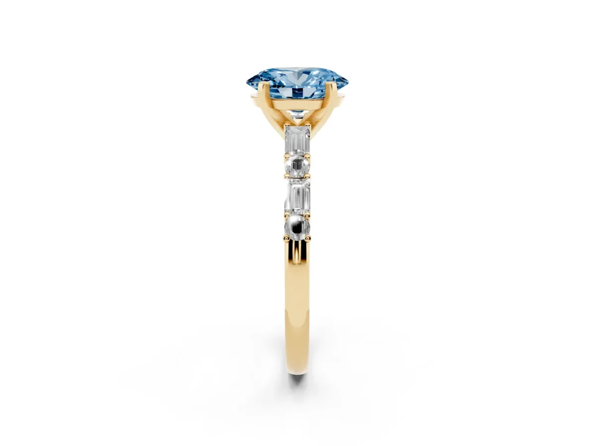Fancy Blue Oval Cut Diamond Solitaire with Side Baguettes and Channel Set Band Yellow gold