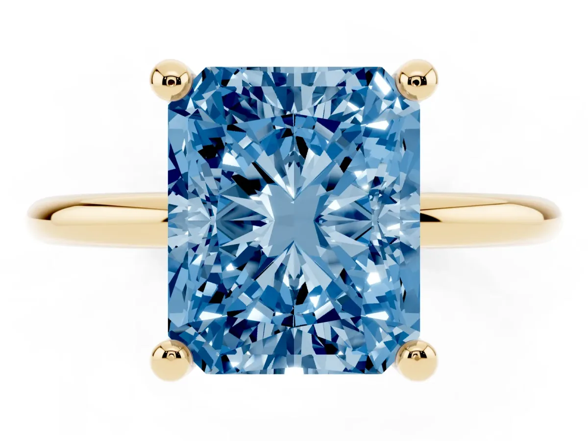 Fancy Blue Radiant Cut Solitaire Diamond Ring with 4-Prong Setting on a Classic Band Yellow gold
