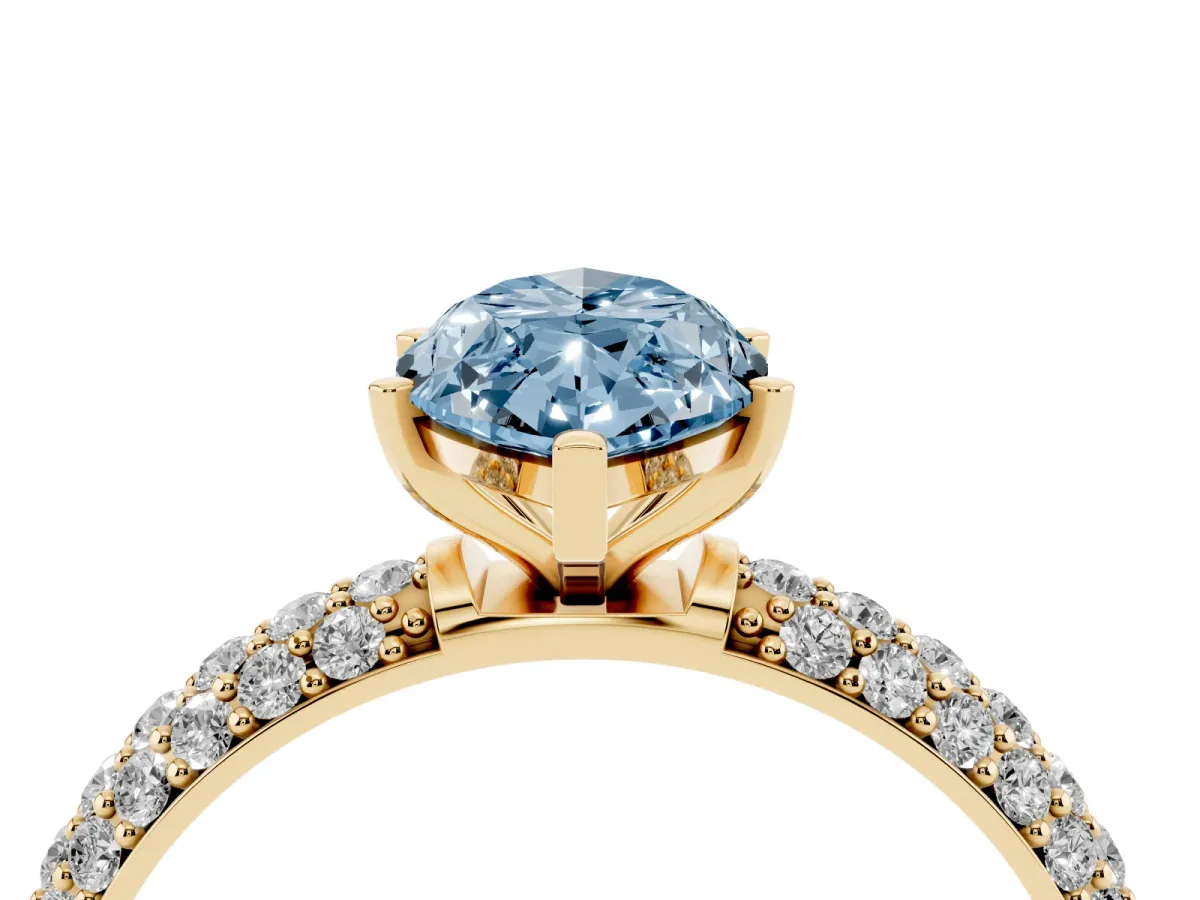Fancy Blue Marquise Cut Diamond Solitaire Ring with Prong Setting and Pavé Band Yellow gold