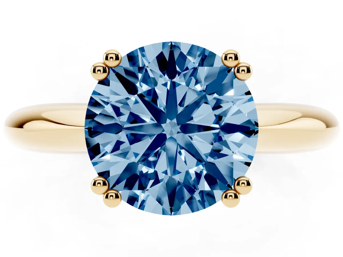 Fancy Blue Round Cut Cut Solitaire Engagement Ring with Tapered Band and Four-Prong Setting Yellow gold