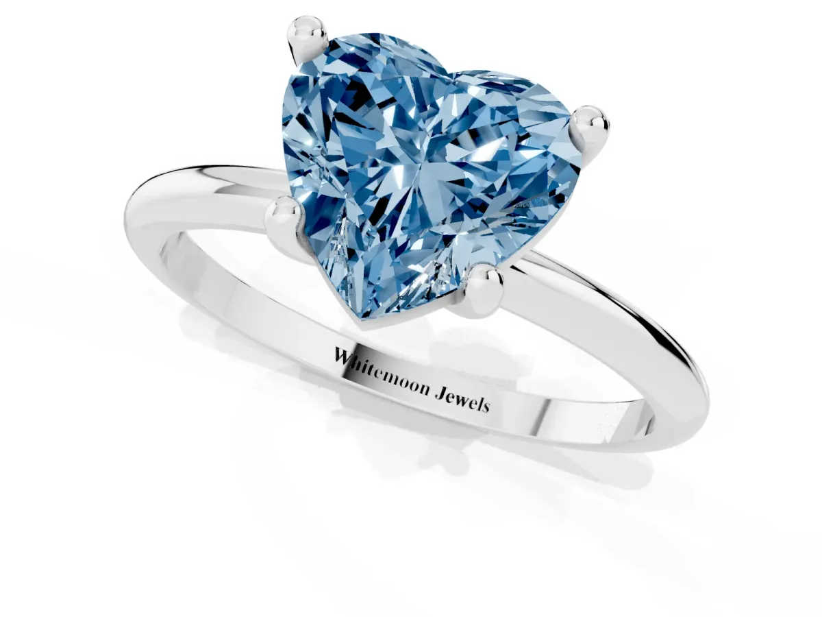 Fancy Blue Heart Cut Solitaire Diamond Ring with 4-Prong Setting on a Classic Band Silver