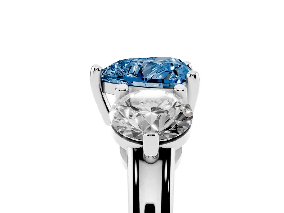 Fancy Blue Three-Stone Heart Cut Brilliant Cut Solitaire Ring with Prong Setting on a Classic Band Silver