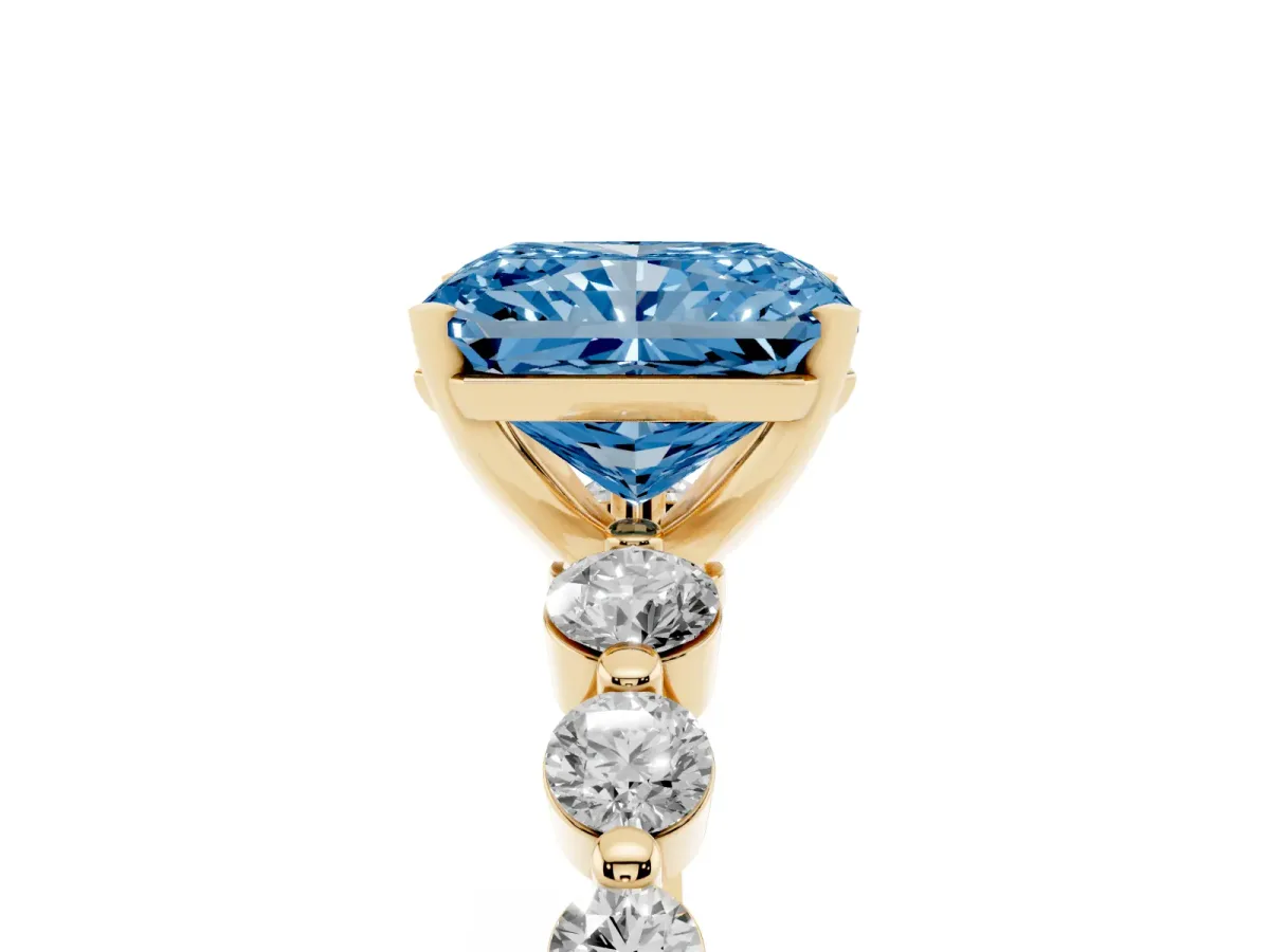 Fancy Blue Radiant Cut Solitaire Diamond Ring with Pave Band and Four-Prong Setting Yellow gold