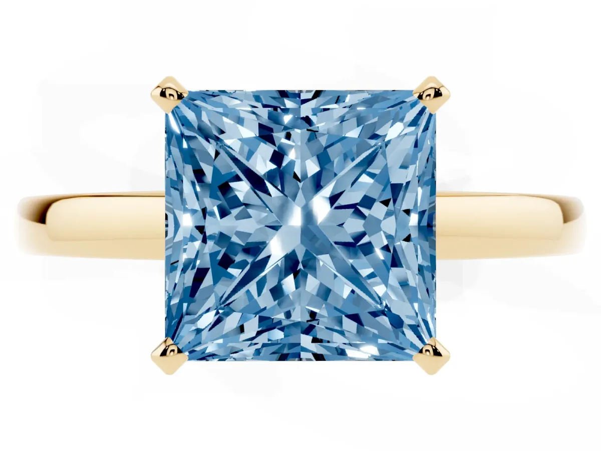 Fancy Blue Princess Cut Solitaire Diamond Engagement Ring with Four-Prong Setting on a Classic Band Yellow gold