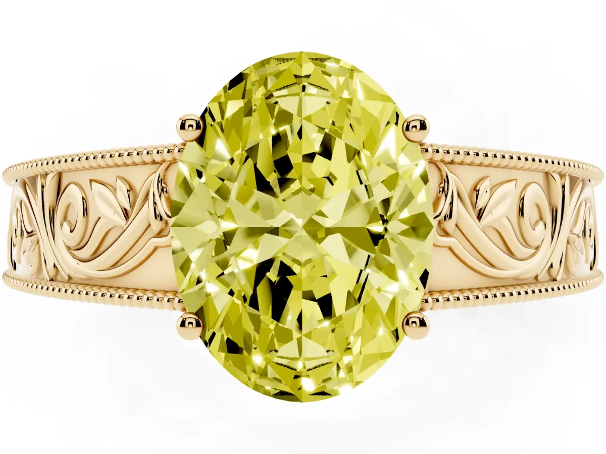 Fancy Yellow Oval Cut Diamond Solitaire Ring with Engraved Band and Four-Prong Setting Yellow gold