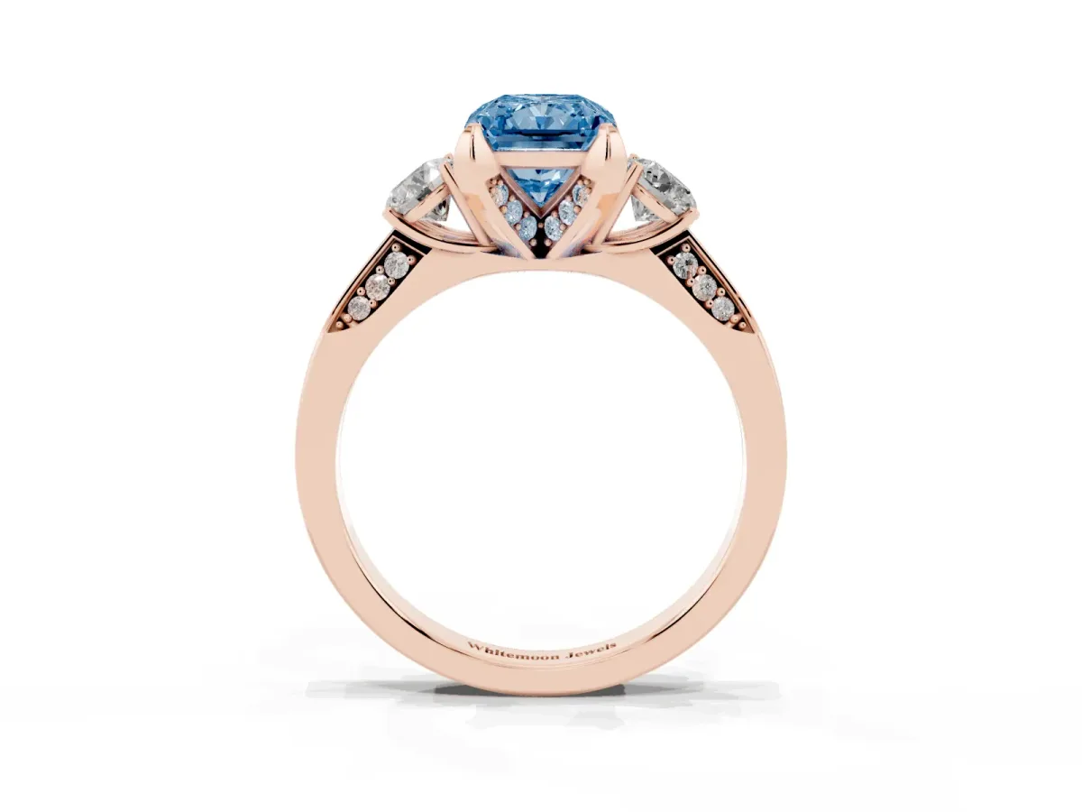 Fancy Blue Radiant Cut Brilliant Three-Stone Diamond Ring with Pavé Band and Four-Prong Setting Rose gold
