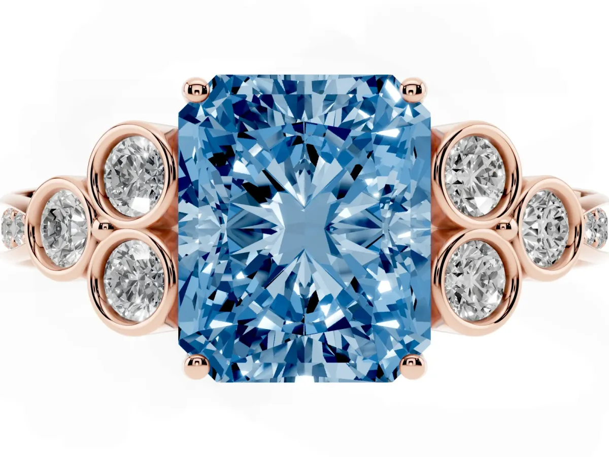 Fancy Blue Radiant Cut Cut Diamond Engagement Ring with Bezel Set Round Side Stones and Prong Setting Rose gold