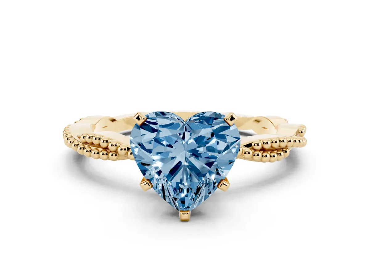 Fancy Blue Heart Cut Solitaire Twisted Band with Bead Prong Setting Yellow gold