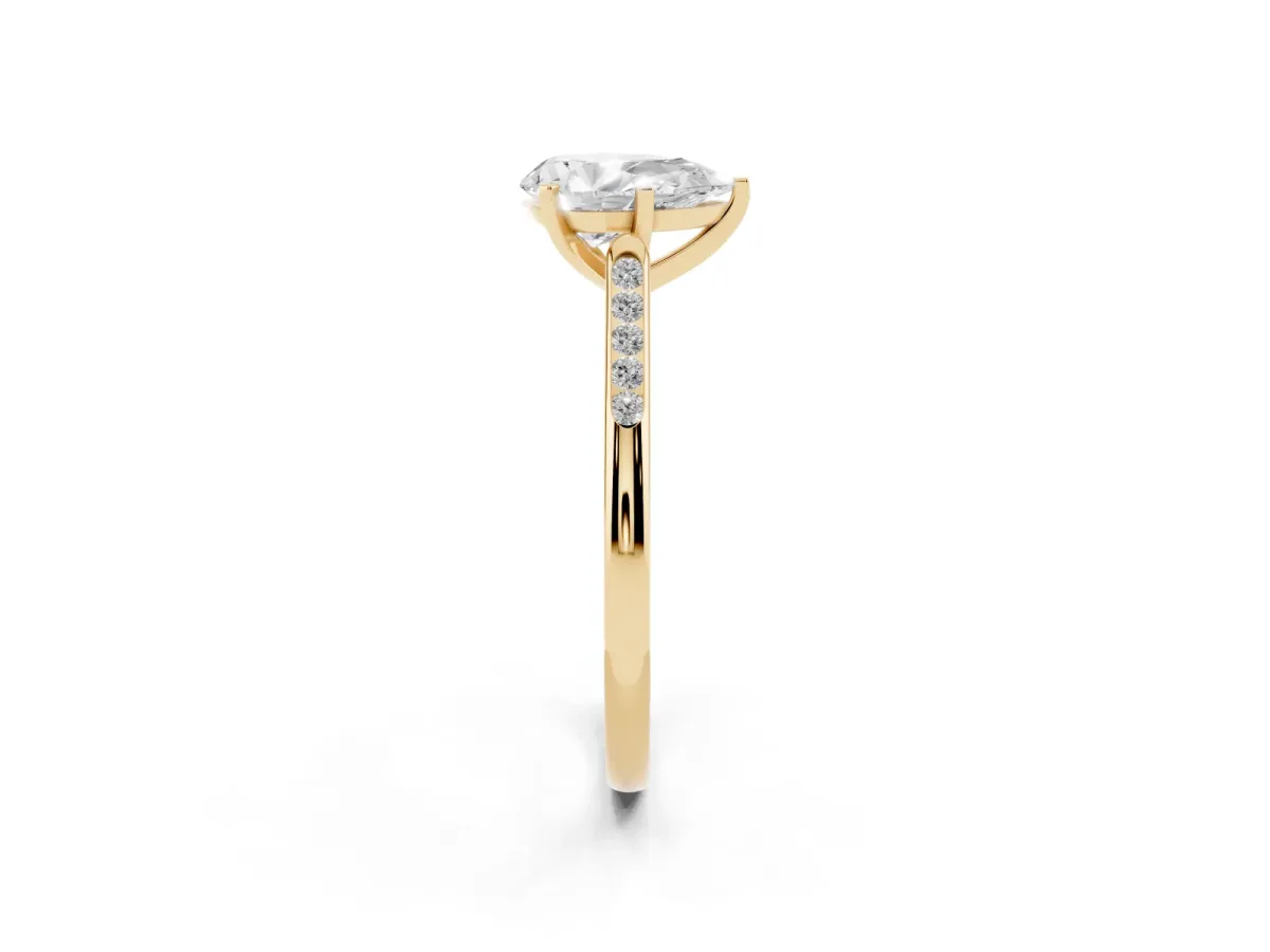 Pear Cut Diamond Solitaire Ring with Channel Set Round Band and Prong Setting Yellow gold
