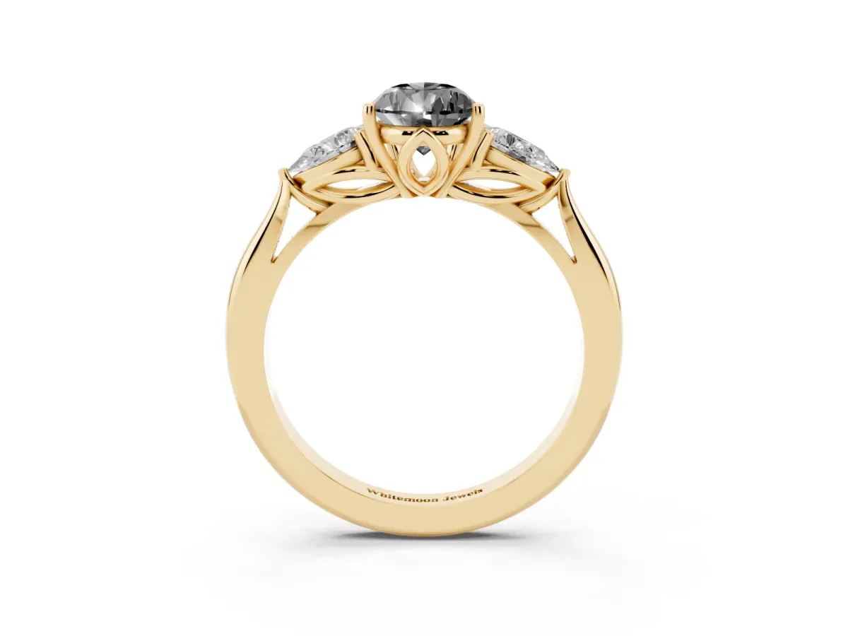 Fancy Black Three-Stone Pear Cut Brilliant Diamond Solitaire Ring with Tapered Band and Four-Prong Setting Yellow gold
