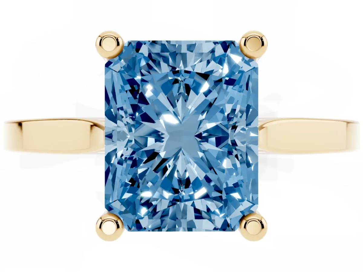 Fancy Blue Radiant Cut Solitaire Diamond Ring with Four-Prong Setting and Tapered Band Yellow gold