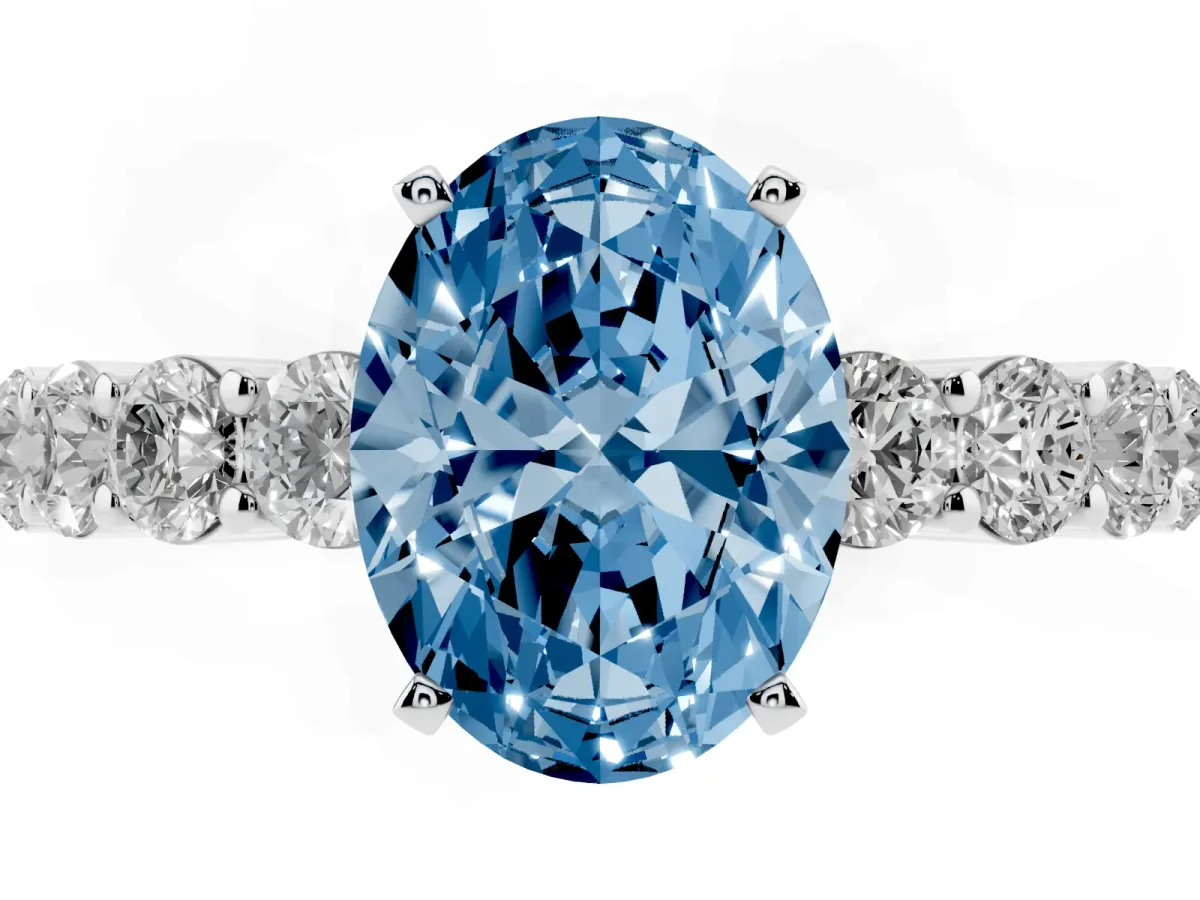 Fancy Blue Oval Cut Diamond Solitaire Ring with Shared Prong Round Side Stones Silver