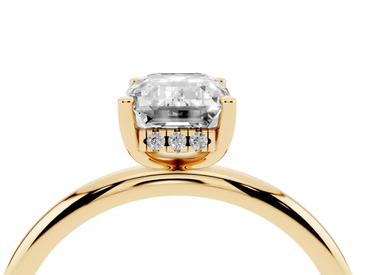 Emerald Cut Cut Solitaire Engagement Ring with Four-Prong Setting and Classic Band Yellow gold