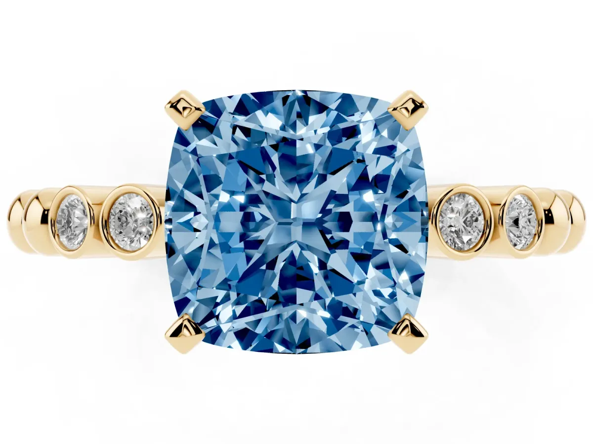 Fancy Blue Cushion Cut Solitaire Bezel Accent Diamond Engagement Ring with Beaded Band and Four-Prong Setting Yellow gold