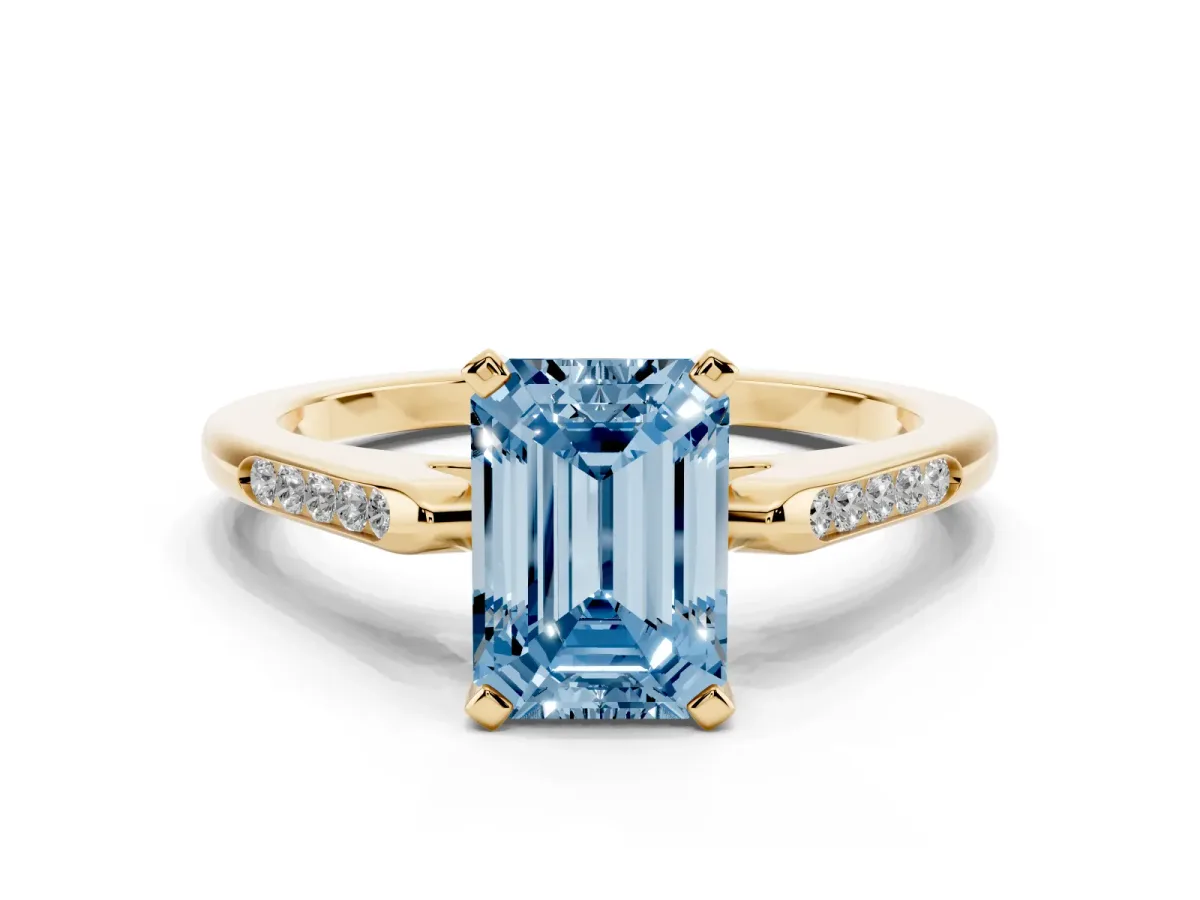 Fancy Blue Emerald Cut Diamond Solitaire Ring with Channel Set Round Band and Prong Setting Yellow gold