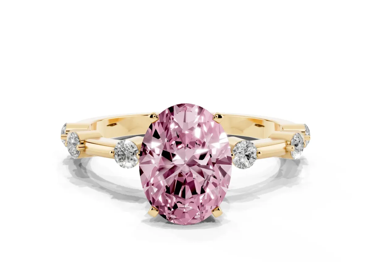 Fancy Pink Oval Cut Solitaire Diamond Ring with Bezel Set Side Stones and Prong Setting Yellow gold