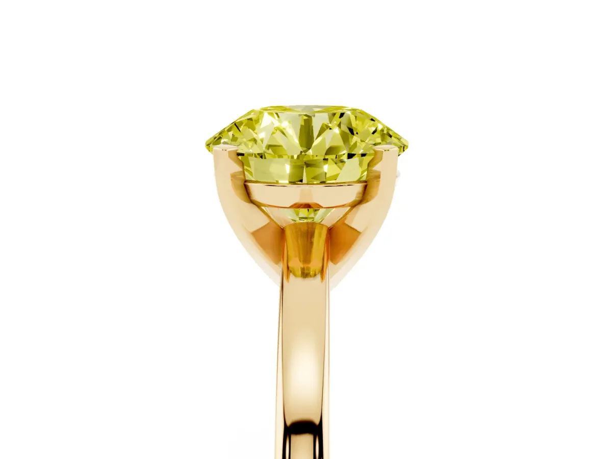 Fancy Yellow Round Cut Solitaire Diamond Engagement Ring with Four-Prong Setting on a Classic Band Yellow gold