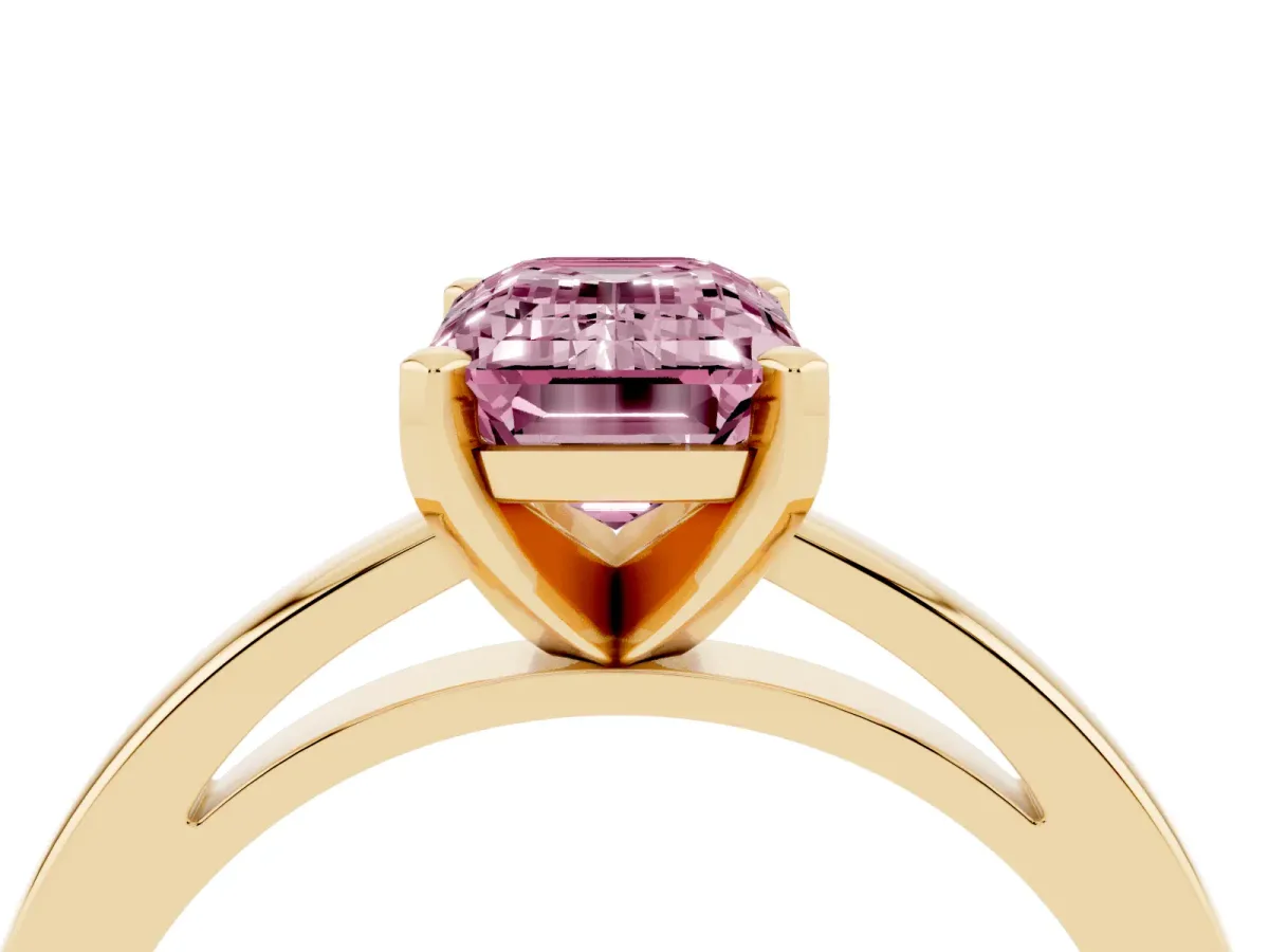 Fancy Pink Emerald Cut Solitaire Diamond Engagement Ring with Four-Prong Setting on a Classic Band Yellow gold