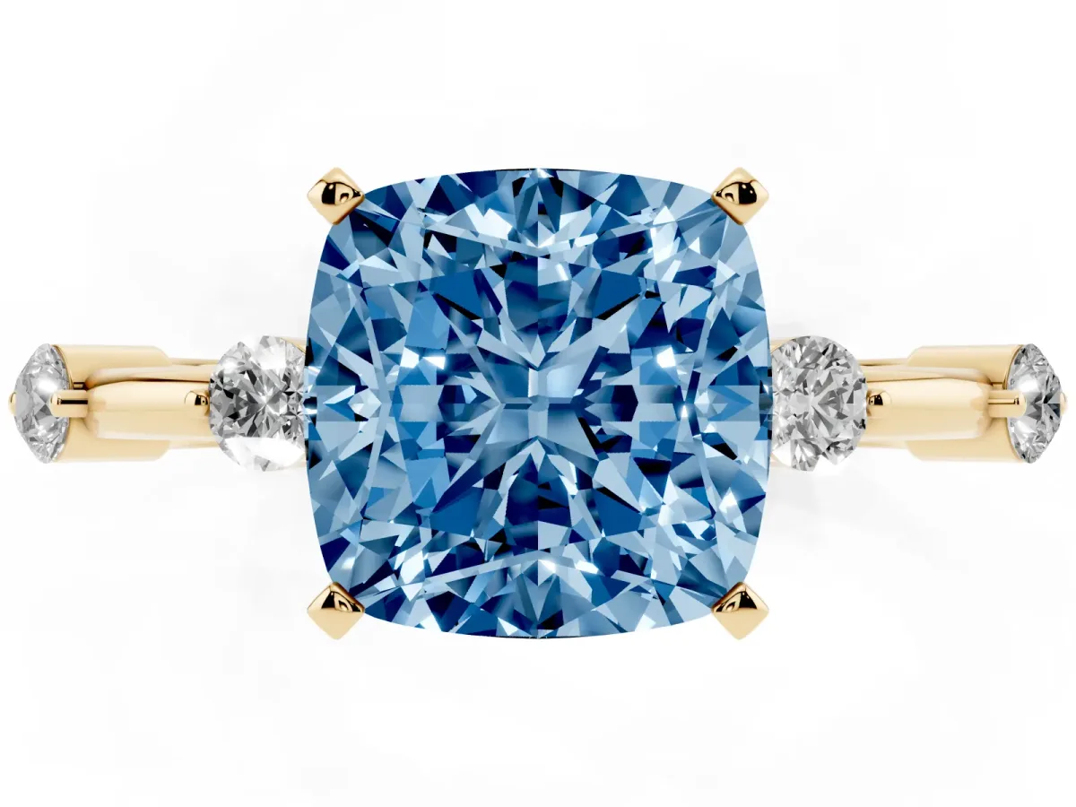 Fancy Blue Cushion Cut Solitaire Diamond Ring with Bezel Set Side Stones and Prong Setting Yellow gold