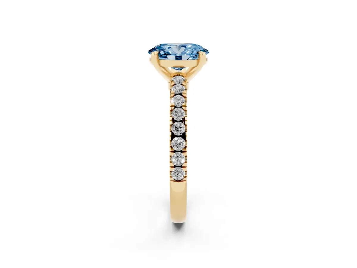 Fancy Blue Oval Cut Solitaire Diamond with Pavé Band and Four-Prong Setting Yellow gold