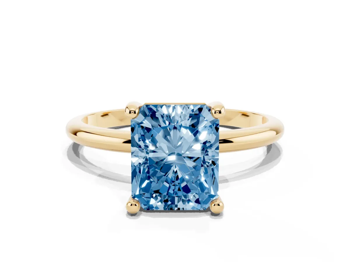 Fancy Blue Radiant Cut Solitaire Diamond Ring with 4-Prong Setting on a Classic Band Yellow gold