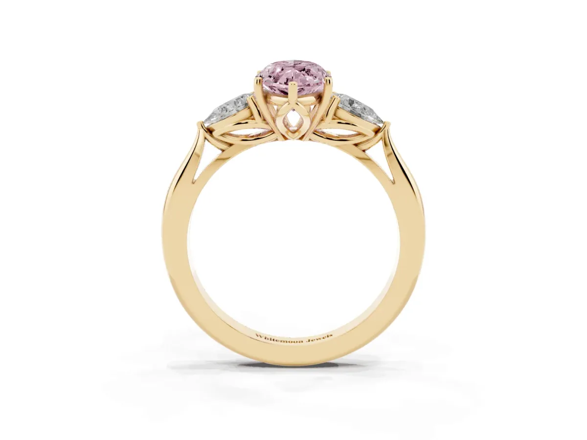 Fancy Pink Three-Stone Marquise Cut Diamond Ring with Pear Side Stones in Four-Prong Setting Yellow gold