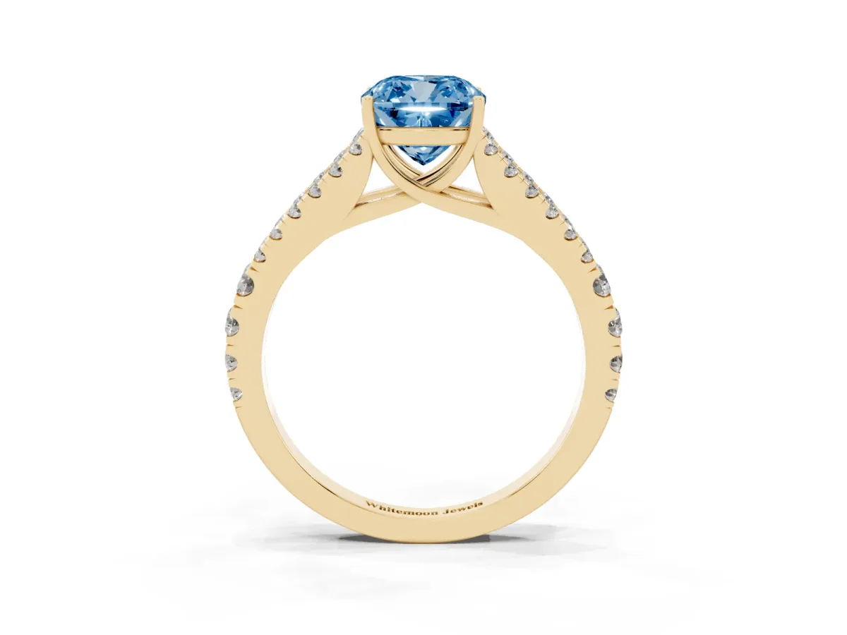Fancy Blue Cushion Cut Diamond Split Shank Pavé Engagement Ring with Four-Prong Setting Yellow gold
