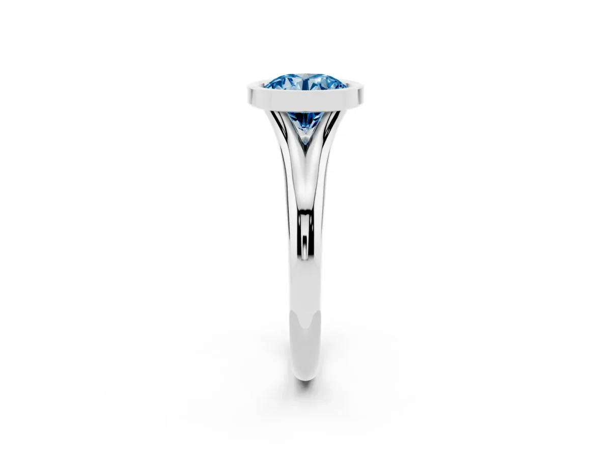 Fancy Blue Bezel Set Round Cut Solitaire Diamond Ring with Smooth Band Silver