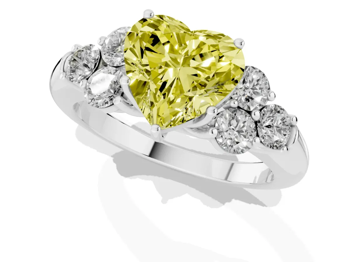 Fancy Yellow Heart Cut Cut Diamond Cluster Ring with Round Accent Stones and Prong Setting on a Classic Band White gold