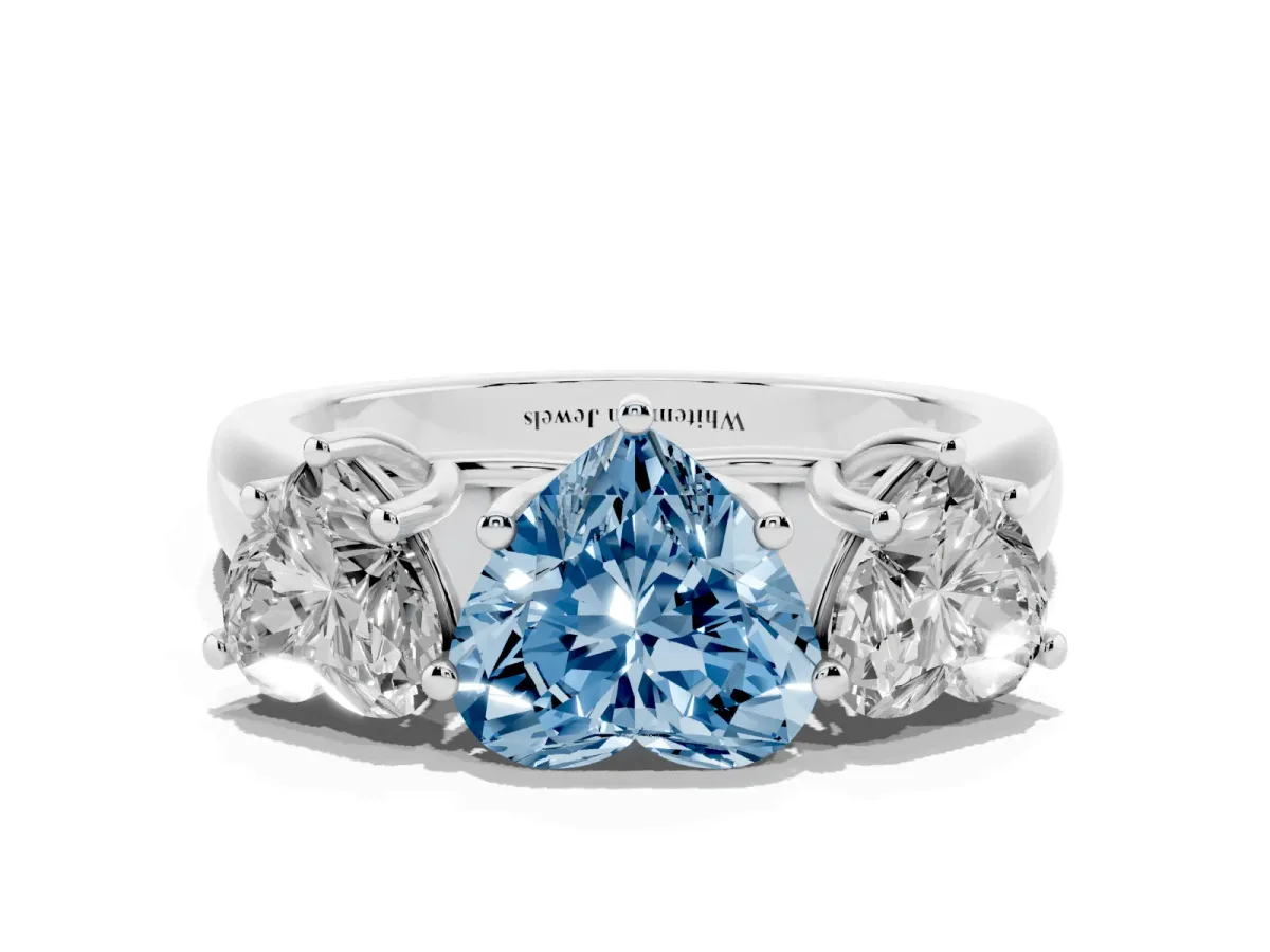 Fancy Blue Heart Cut Three-Stone Diamond Ring with Prong Setting on a Classic Band Platinum