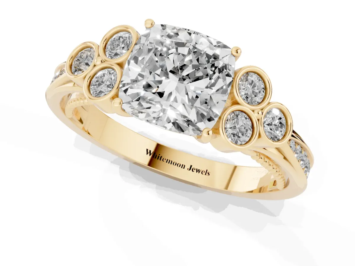 Cushion Cut Cut Diamond Engagement Ring with Bezel Set Round Side Stones and Prong Setting Yellow gold