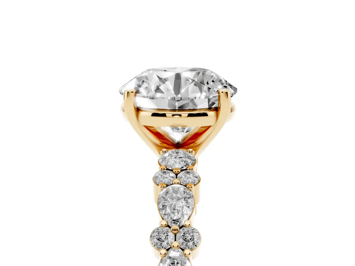 Round Cut Diamond Side Stone Solitaire Ring with Round and Four-Prong Setting Yellow gold