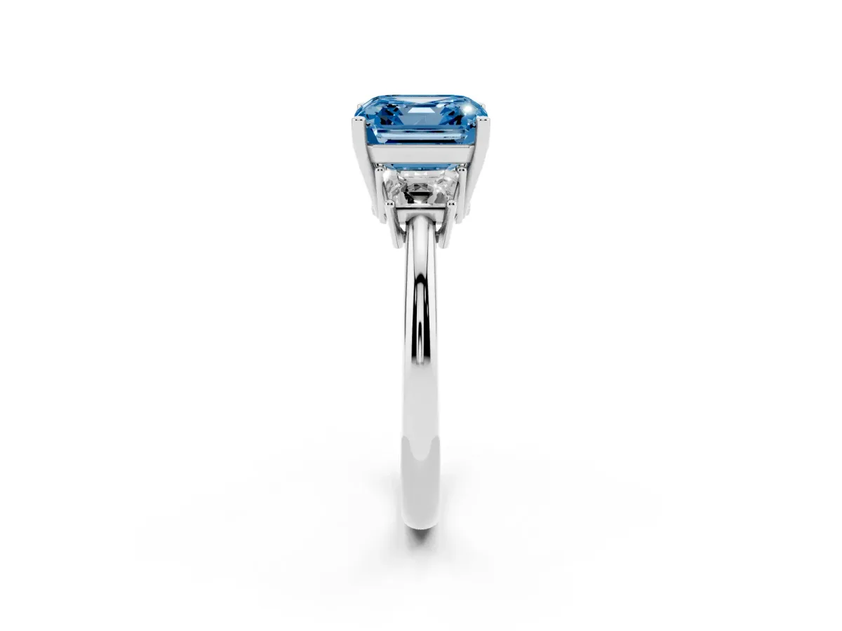 Fancy Blue Asscher Cut Diamond Three-Stone Ring with Trapezoid Side Stones and Prong Setting Platinum