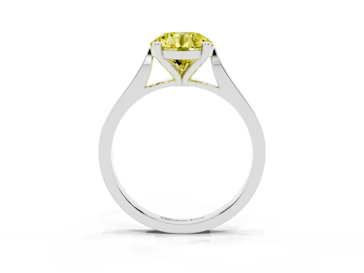 Fancy Yellow Round Cut Solitaire Diamond Ring with Four-Prong Setting and Tapered Band Silver