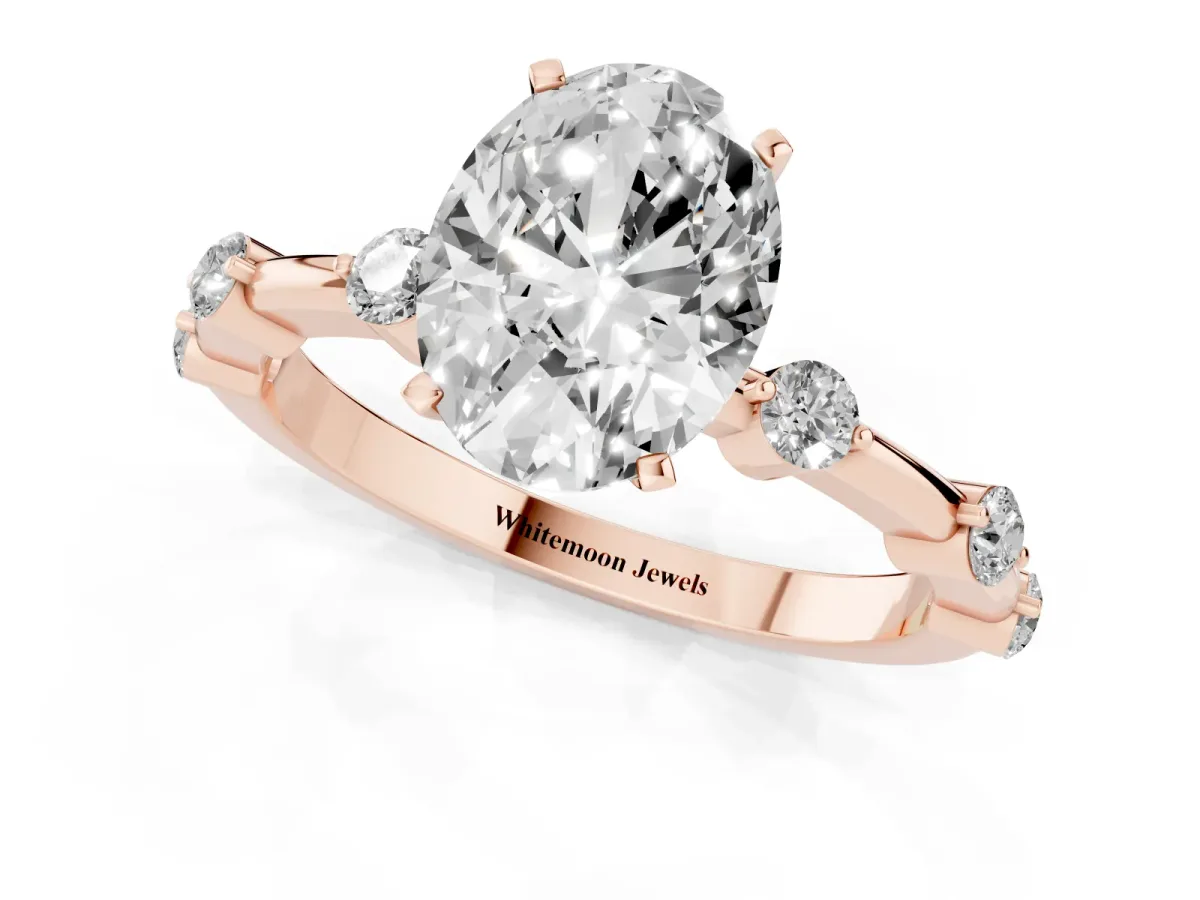Oval Cut Solitaire Diamond Ring with Bezel Set Side Stones and Prong Setting Rose gold