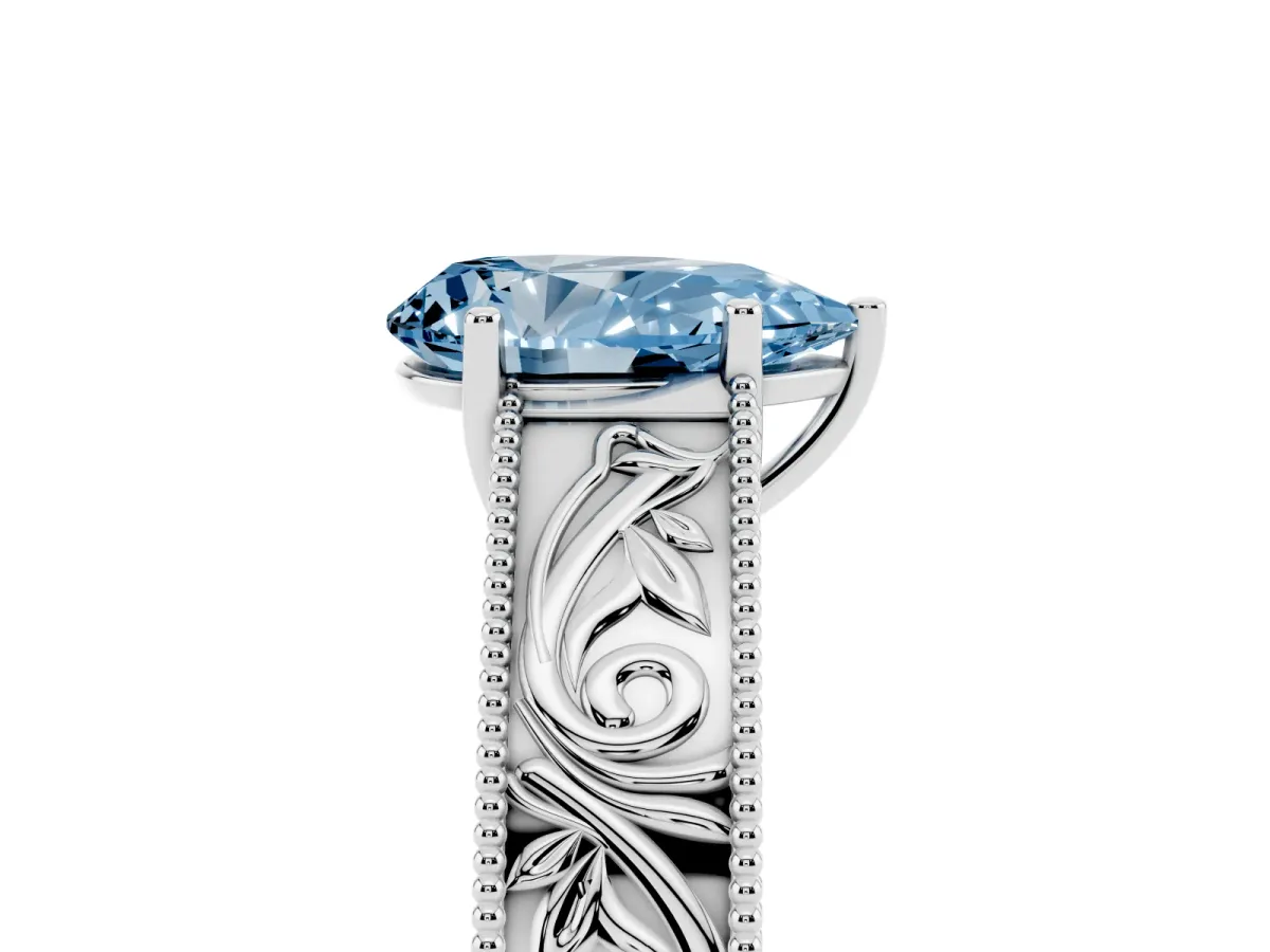 Fancy Blue Pear Cut Diamond Solitaire Ring with Engraved Band and Four-Prong Setting White gold