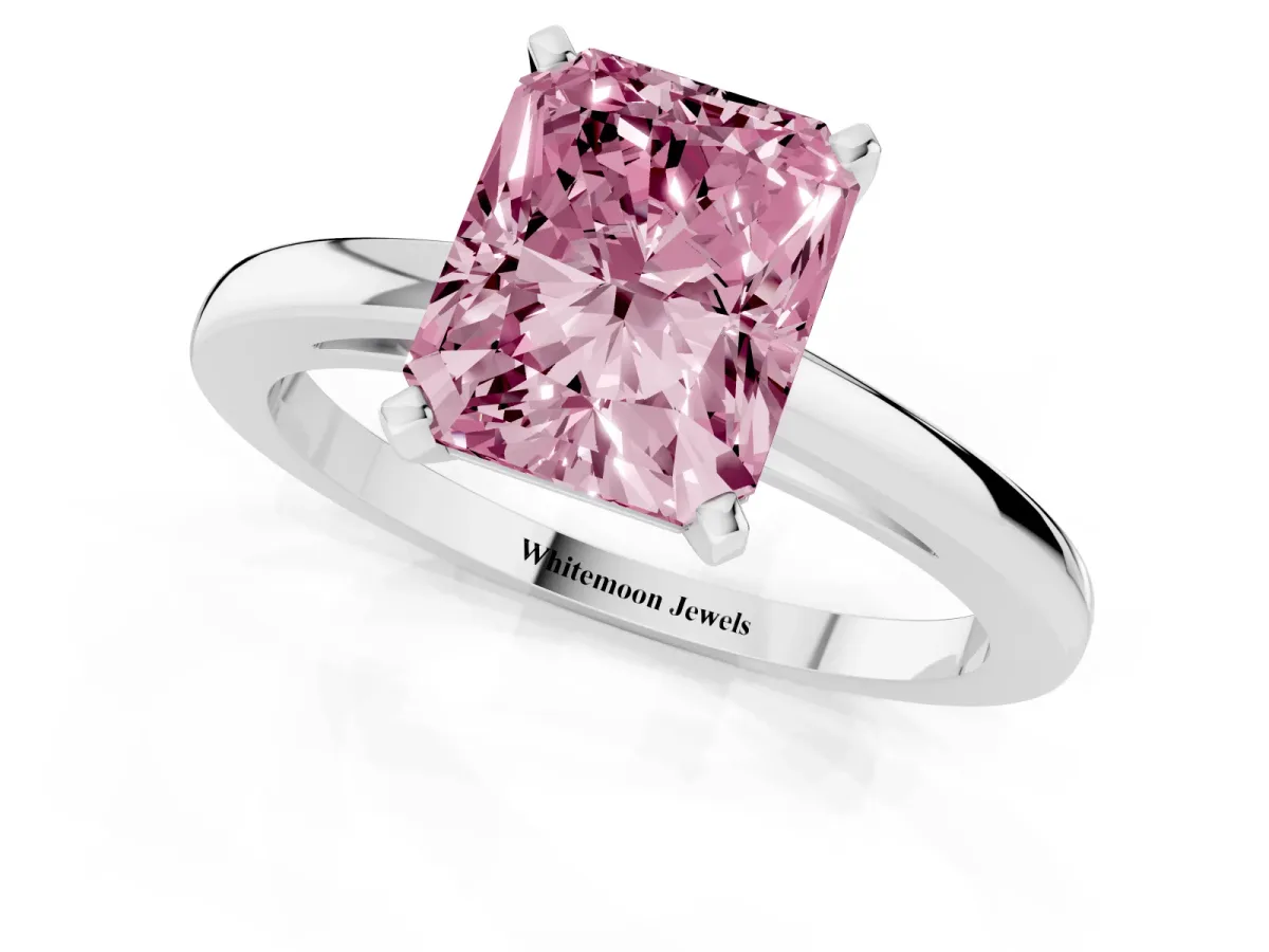 Fancy Pink Radiant Cut Solitaire Diamond Engagement Ring with Four-Prong Setting on a Classic Band Silver