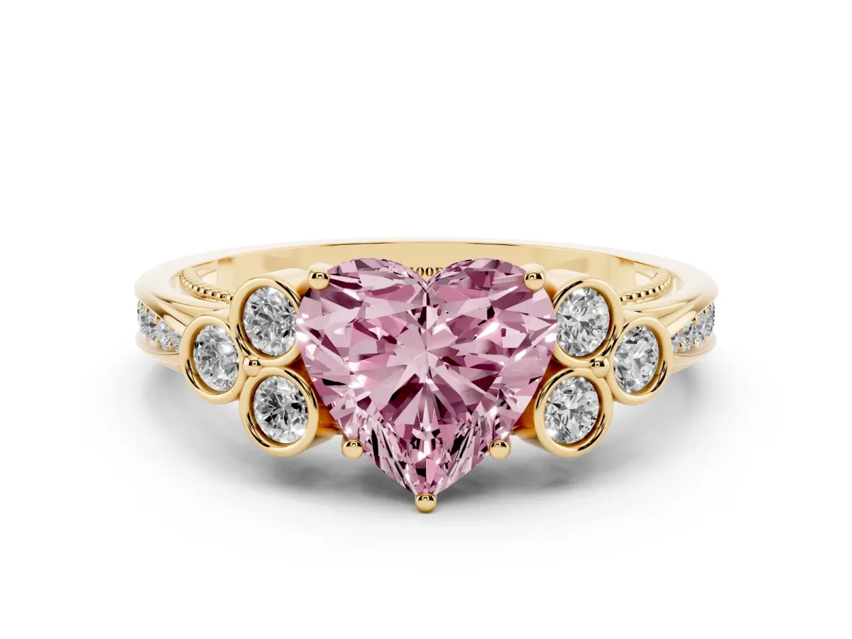 Fancy Pink Heart Cut Cut Diamond Engagement Ring with Bezel Set Round Side Stones and Prong Setting Yellow gold