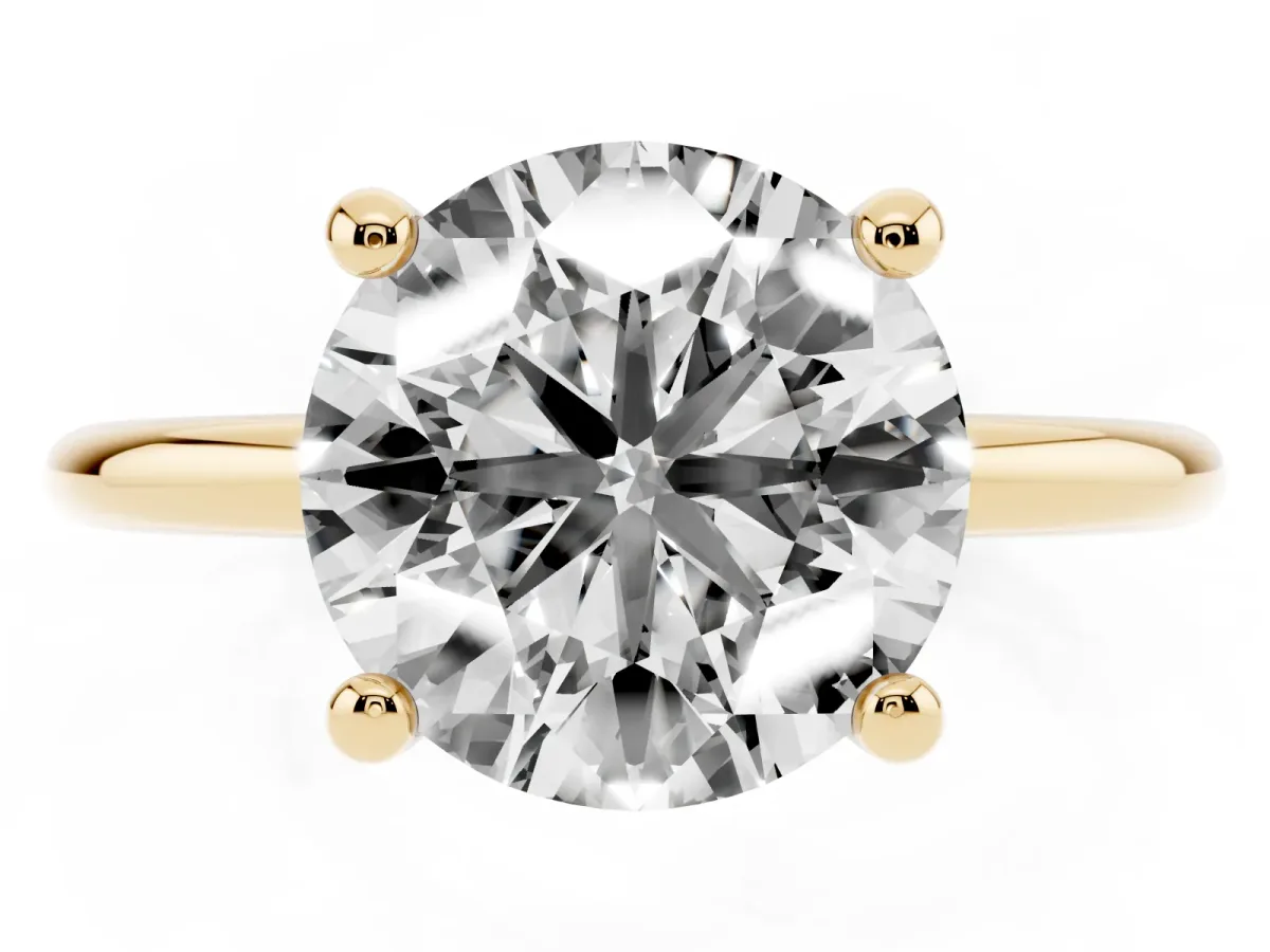 Round Cut Solitaire Diamond Ring with 4-Prong Setting on a Classic Band Yellow gold