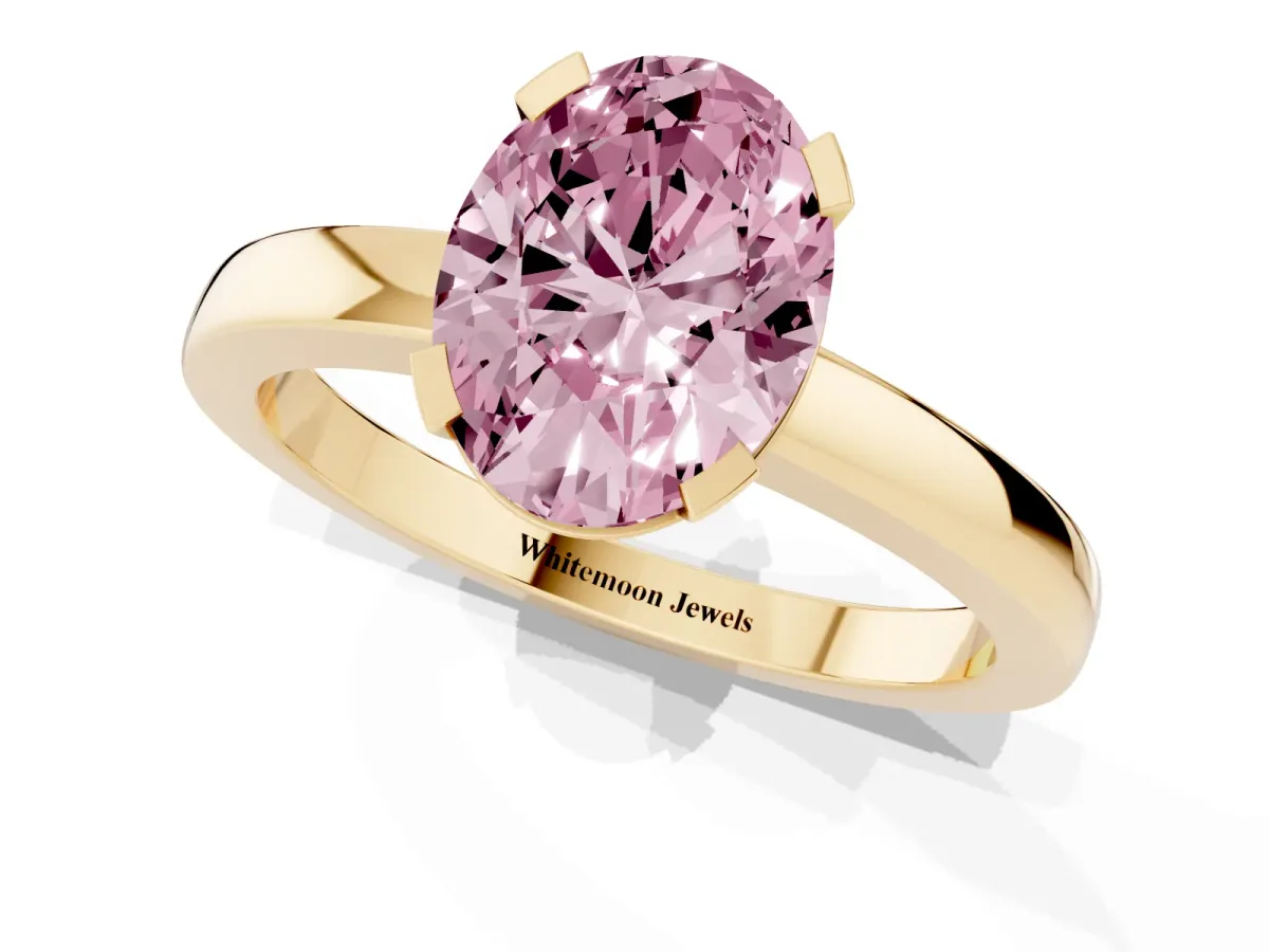 Fancy Pink Oval Cut Cut Solitaire Ring with Four-Prong Setting and Classic Band Yellow gold