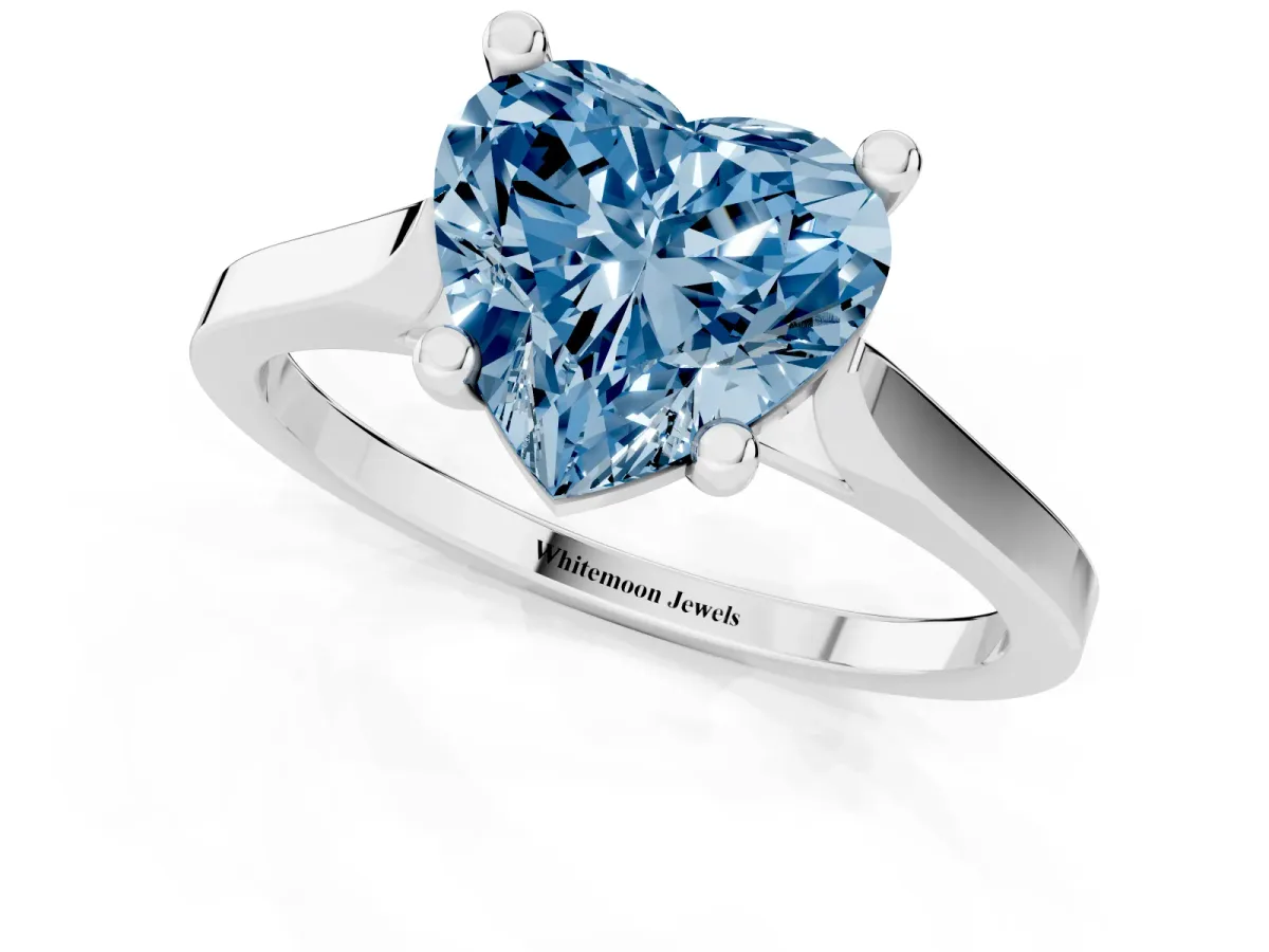Fancy Blue Heart Cut Solitaire Diamond Ring with Four-Prong Setting and Tapered Band Platinum