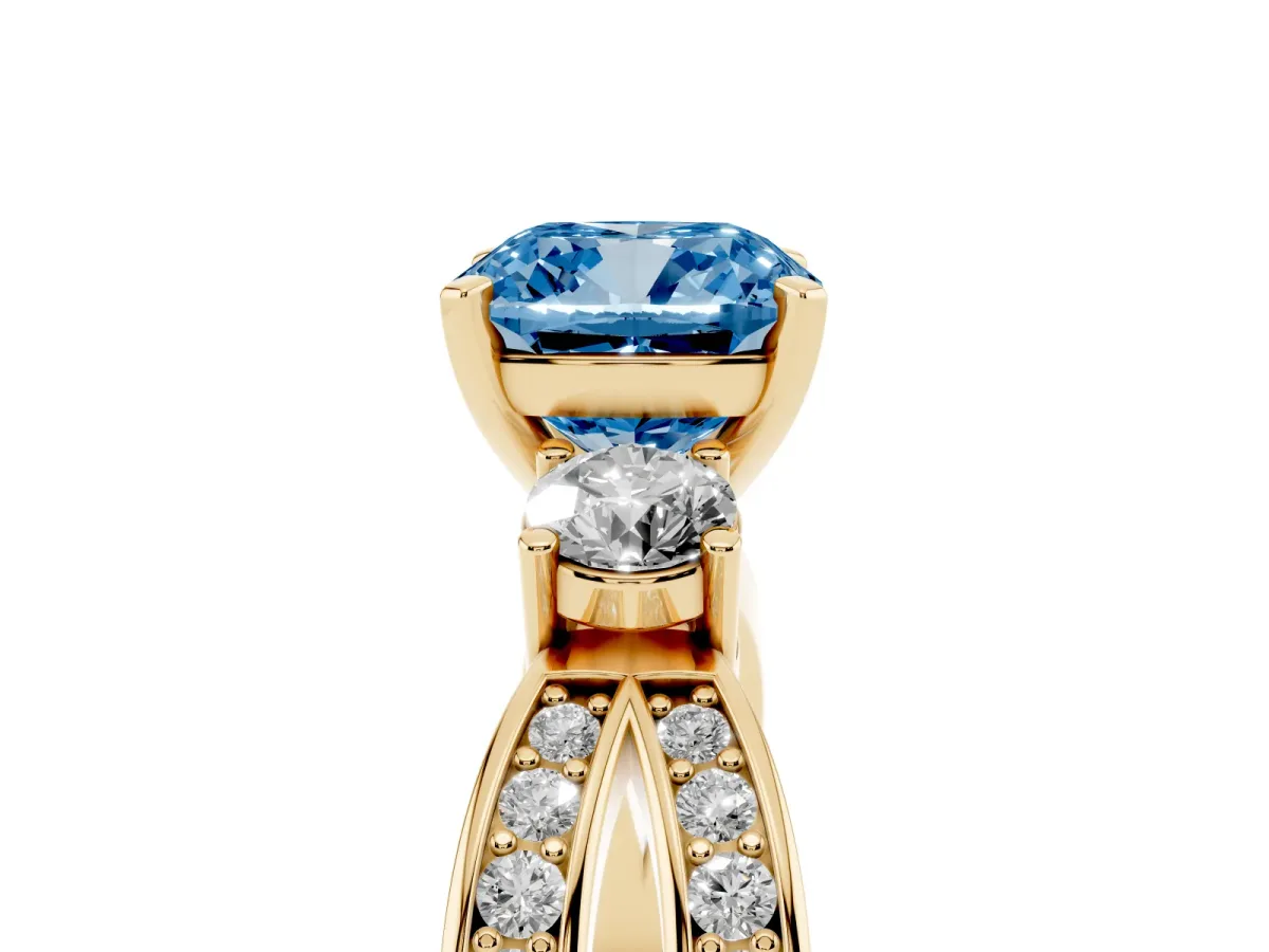 Fancy Blue Three-Stone Cushion Cut Cut Diamond Twist Band with Prong Setting Yellow gold