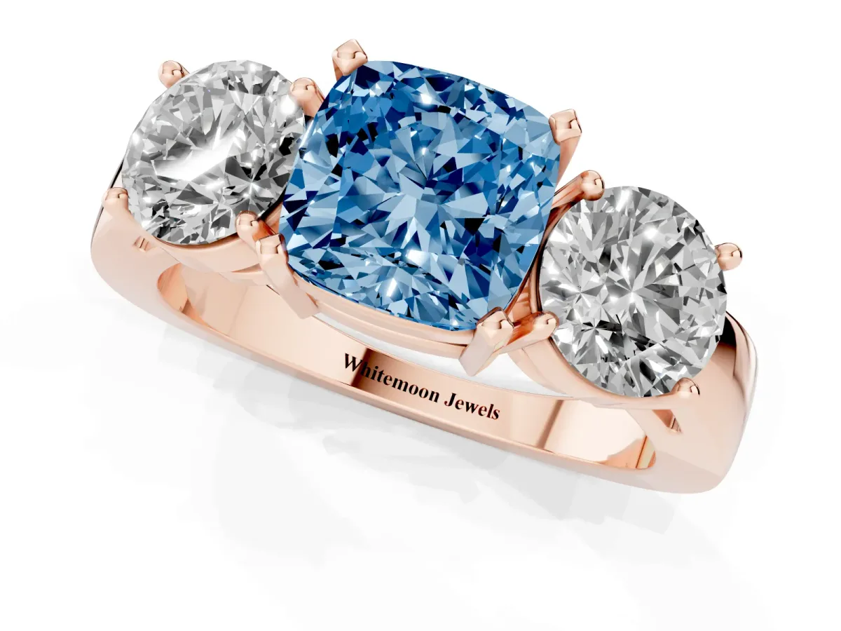 Fancy Blue Three-Stone Cushion Cut Diamond Ring with Round Side Stones, Classic Band, and Four-Prong Setting Rose gold