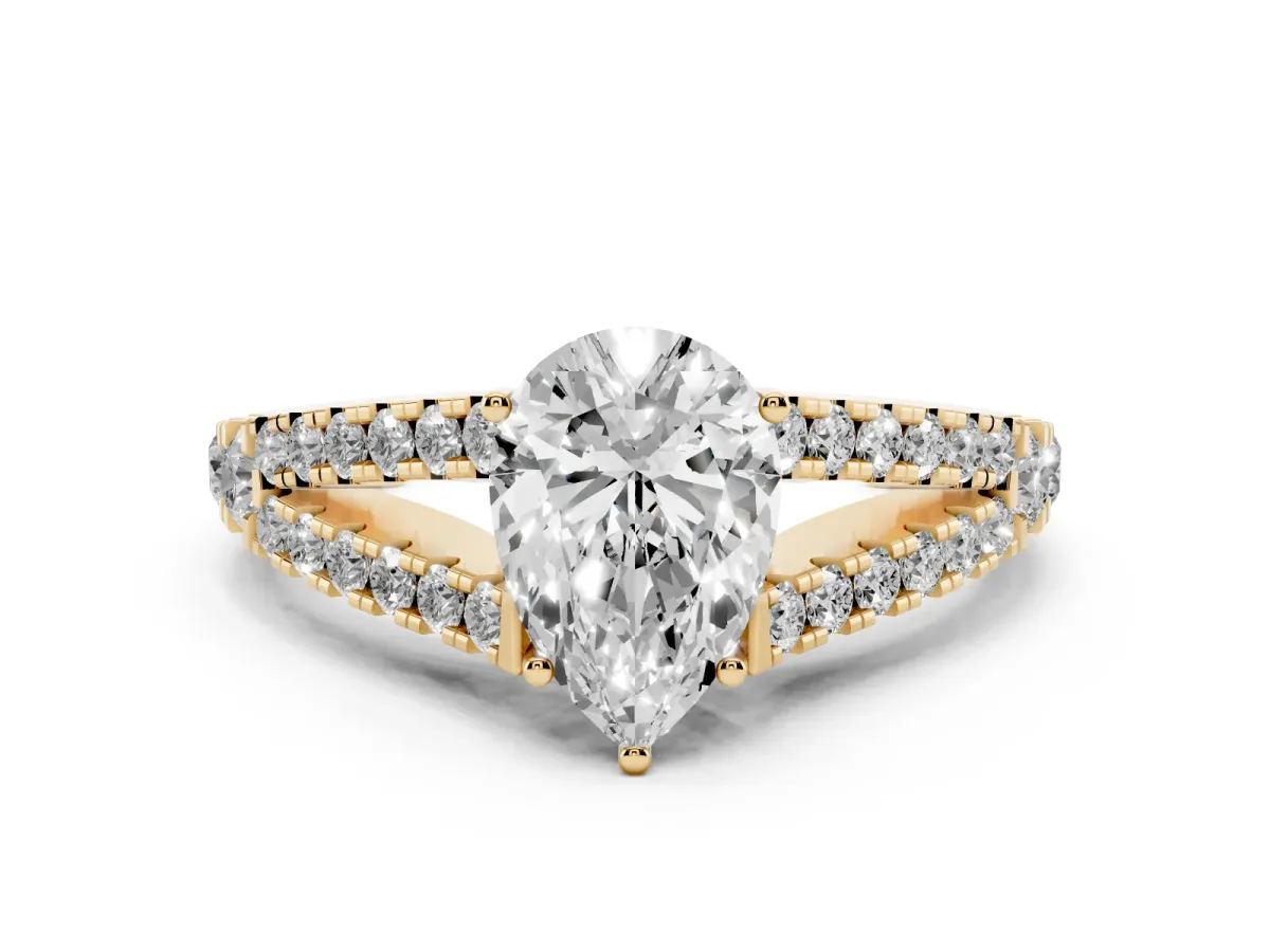 Pear Cut Diamond Split Shank Engagement Ring with Round Pavé and Prong Setting Yellow gold