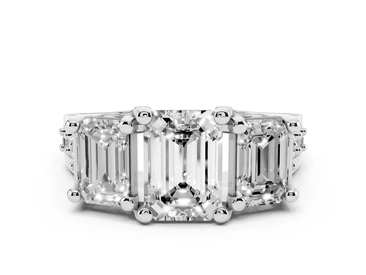 Emerald Cut Diamond Three-Stone Ring with Channel Set Band and Four-Prong Setting Silver