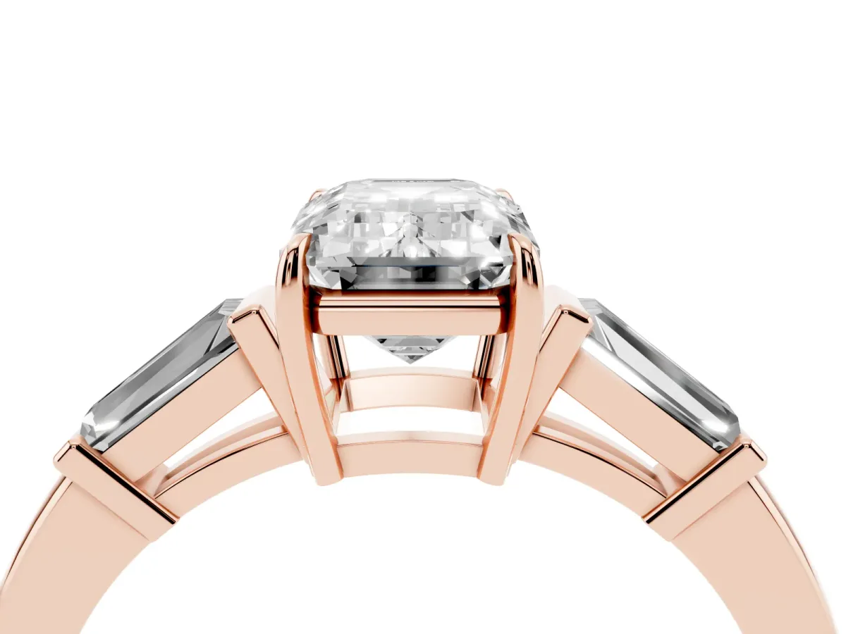 Emerald Cut Diamond Three-Stone Ring with Tapered Baguette Side Stones and Prong Setting Rose gold