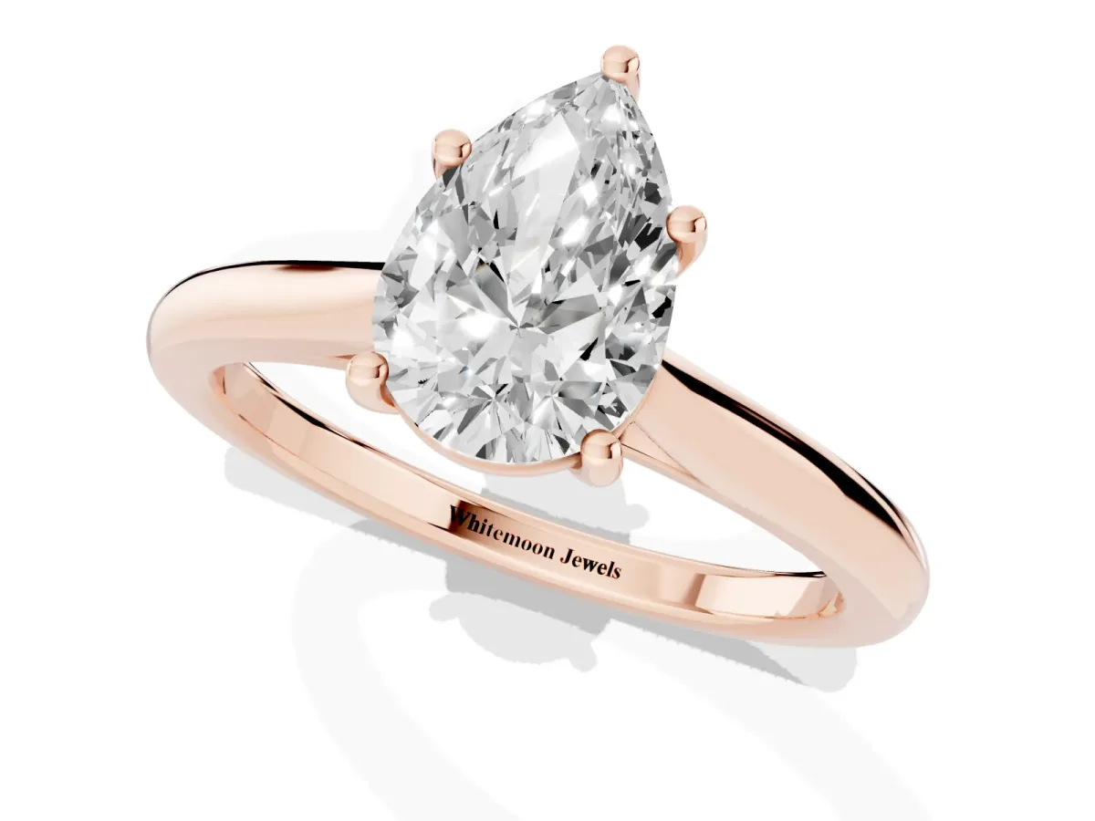 Pear Cut Cut Solitaire Ring with Cathedral Band and Four-Prong Setting Rose gold