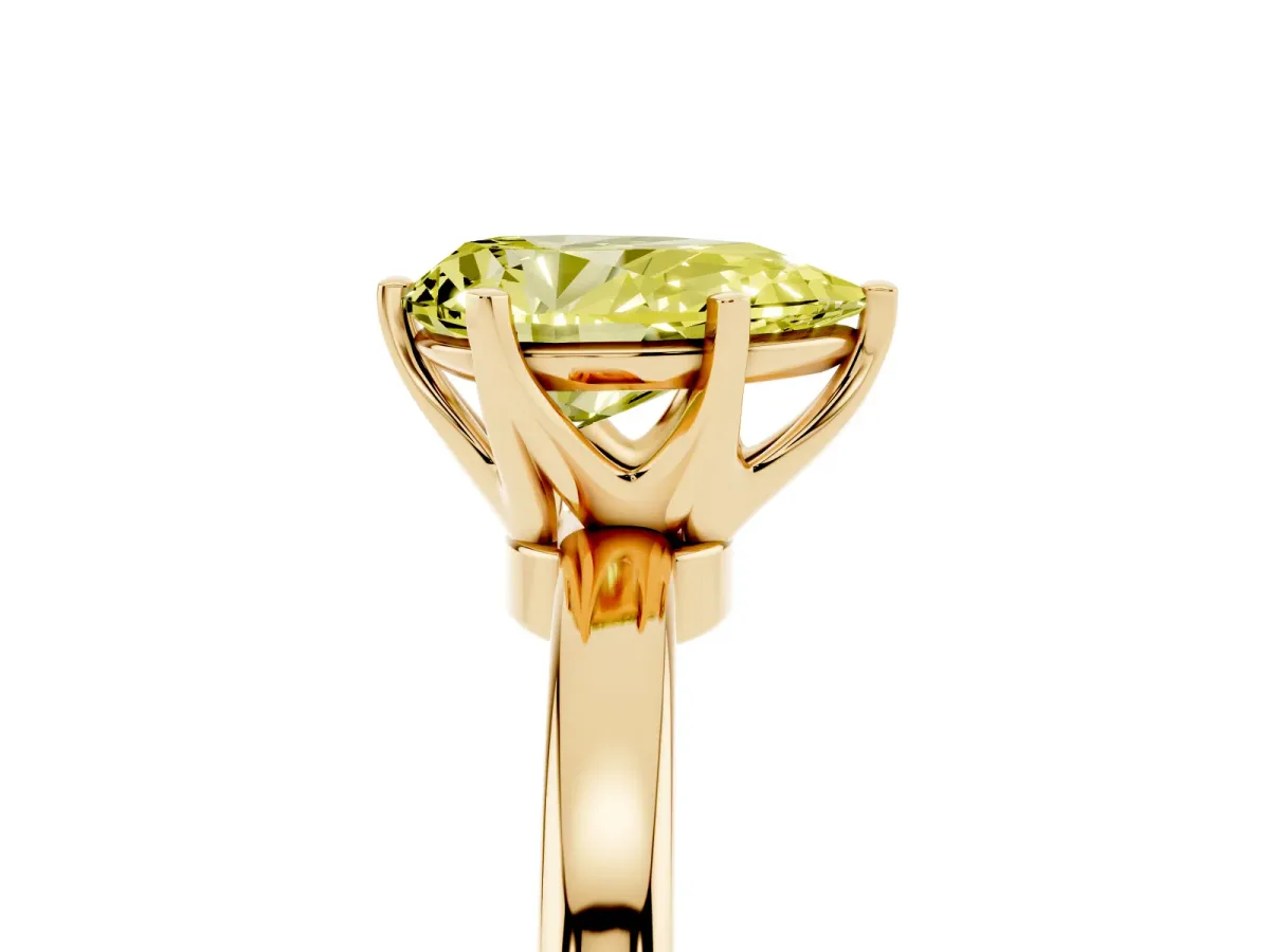 Fancy Yellow Pear Cut Solitaire Diamond Ring with Six-Prong Setting on a Classic Band Yellow gold