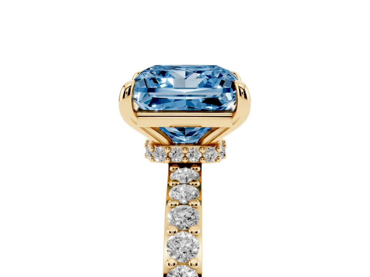 Fancy Blue Princess Cut Diamond Pavé Engagement Ring with Round Accents and Prong Setting Yellow gold