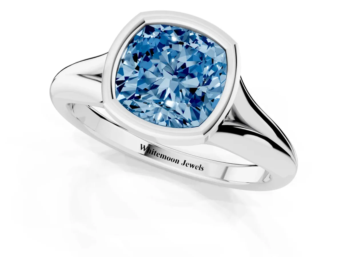 Fancy Blue Bezel Set Cushion Cut Solitaire Diamond Ring with Smooth Band Platinum